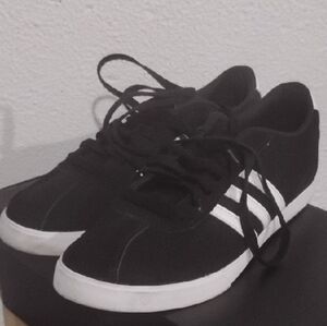 Black Sneakers with White Stripes